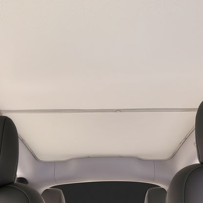 Panoramic roof sunshade installed in Tesla Model Y to block sunlight, reduce glare, and improve interior cooling comfort