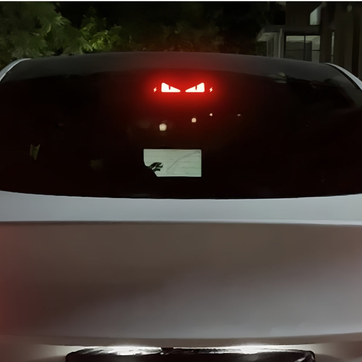 Rear brake light decorative trim insert for Tesla Model Y, designed for quick clip-on installation without tools